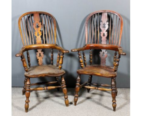 Two 19th Century ash and elm "Yorkshire" Windsor stick back armchairs, each with fretted splats, wood seats on turned legs