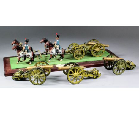 A painted lead scratch-built model of a French gun and limber pulled by four horses, mounted on hardwood base, 18.5ins x 6.5i
