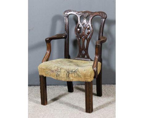 A 20th Century child's mahogany armchair of  "Country Chippendale" design, with carved shaped crest rails, fretted ribbon spl