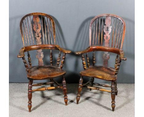 Two 19th Century ash and elm "Yorkshire" Windsor stick back armchairs, each with fretted splats, wood seats on turned legs