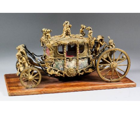 A gilt and painted lead scratch-built model of the Gold State Coach, mounted on hardwood base, 14ins x 6.5ins x 7.25ins high