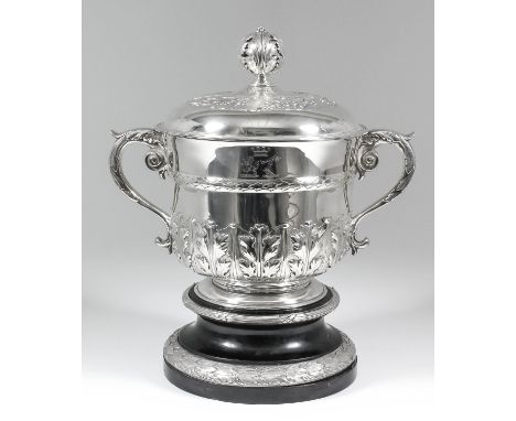 A late Victorian silver two-handled porringer and cover, the domed cover with pierced and cast leaf and berry pattern finial,