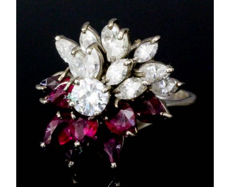 A modern 9ct white gold mounted diamond and ruby set cluster ring, set with twelve brilliant cut diamonds (approximate total 