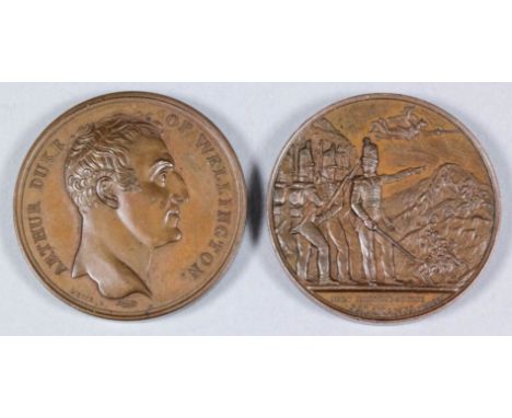 A 19th century copper medal by N. G. A. Brenet for Mudie, the obverse with bust to the right, reverse with figures of Spain a