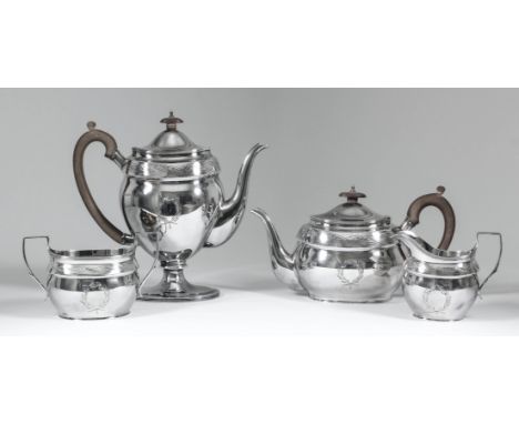 An Elizabeth II silver oval four piece tea and coffee service with slightly domed covers, reeded rims engraved with band of s