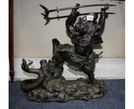 An impressive Japanese bronze figure group of a Samurai warrior and serpent, Meiji period, 57cm high.