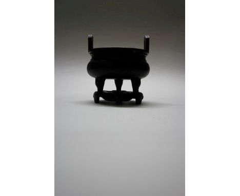 A Chinese bronze twin handled tripod censer and stand, archaistic mark, 13.5cm diameter, 846g. Condition Report: No damage se