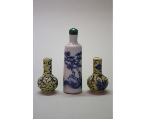 A Chinese blue and white snuff bottle and jade stopper, possibly 18th century, 9cm high; together with a pair of small yellow