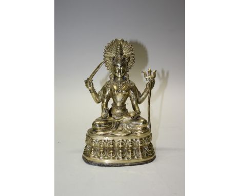 A Sino-Tibetan bronze bodhisattva, with four arms, holding a sword and a trident, 23.5cm high.  