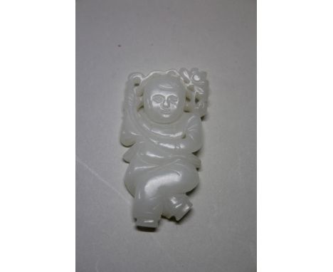 A Chinese carved and pierced white jade figure of a boy, 7cm high. Condition Report: no damage seen