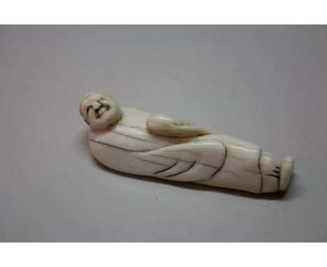 A Japanese carved ivory netsuke of a sage, 18th.19th century, 6cm long.Provenance: Artemesia, 22nd April 1995.