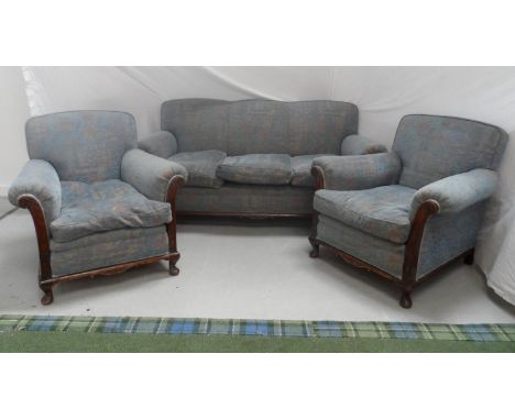 1950'S THREE SEAT SOFA with a shaped back with scroll arms and a mahogany carved frame, standing on stout front supports, 185