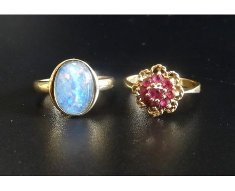 TWO GEM SET NINE CARAT GOLD RINGSone a garnet cluster example and the other with opal triplet, ring sizes N and M-N respectiv