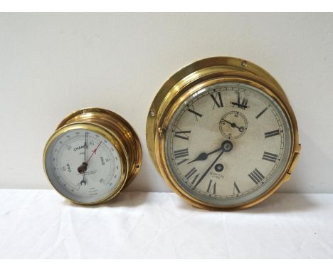 SMITH ASTRAL SHIP'S CLOCKwith a circular brass case, the circular dial with Roman numerals, subsidiary dial and winding hole;