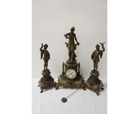 EARLY 20TH CENTURY GILT METAL AND ONYX CLOCK GARNITUREafter Ferrand, the circular enamel dial with Arabic numerals and an eig
