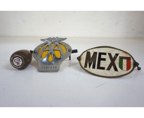 MOTORING INTERESTincluding an oval metal Mexican car badge, a metal Chillie car badge, an AA metal car badge and a mahogany g