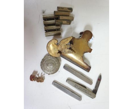 MIXED LOT OF COLLECTABLESincluding a large brass and steel document clip, brass cap badge, Greek embossed badge, Scottish Emp