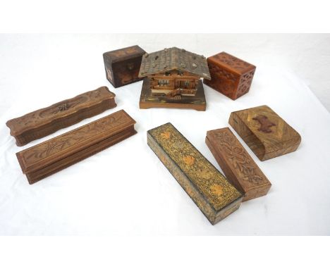 SELECTION OF CARVED BOXESincluding a poker work box with dragons containing playing cards, a carved playing card box, an ebon