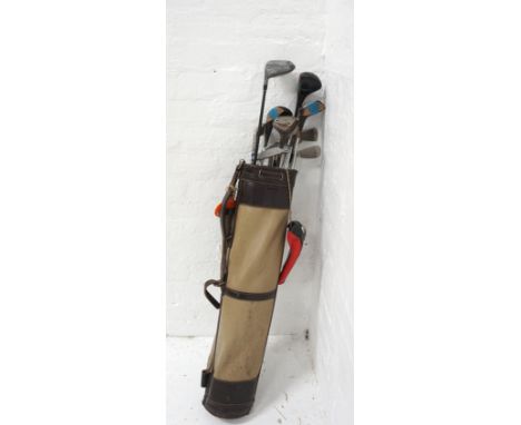 VINTAGE GOLF BAG AND CLUBSincluding a selection of woods, irons and a putter 