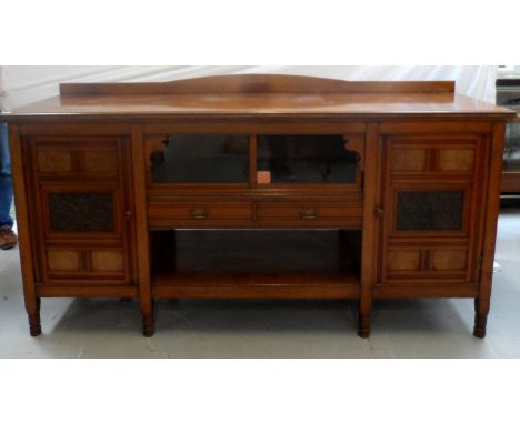 EDWARDIAN OAK SIDE CABINETwith a replaced shaped and raised back above a moulded top with a pair of central glass sliding doo