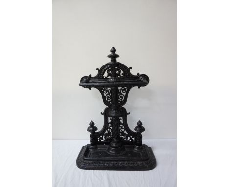 COALBROOKDALE STYLE CAST IRON STICK STANDof shaped outline with pierced decoration, with an upper shaped retention bar above 