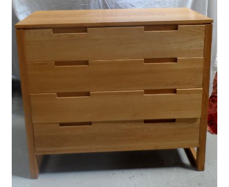 JOHN LEWIS LIGHT OAK CHESTwith a plain top above four long drawers with recessed handles, standing on plain supports united b