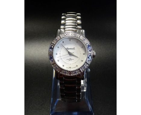 LADIES INGERSOLL GEMS TANZANITE WRISTWATCHthe bezel set with tanzanites, the round dial set with button five minute markers, 