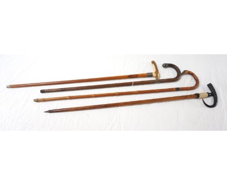 SWISS WALKING STICKwith a goat hoof and horn handle, the shaft marked Kandersteg and the base with a metal point, 91cm long, 