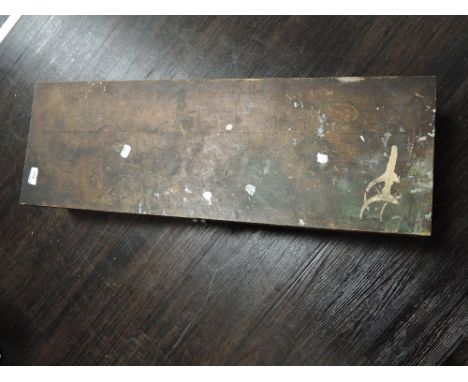 A vintage chest or crate and some axe heads