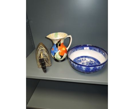 An art deco water jug hand decorated with flowers, a tureen and a stove top iron
