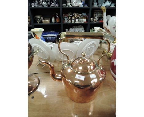 A large vintage copper kettle.
