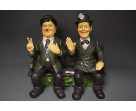 A ceramic Laurel and hardy ornament.