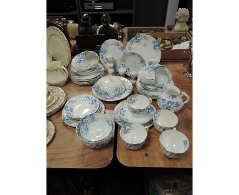 A part tea service in porcelain having blue transfer print and swirl design