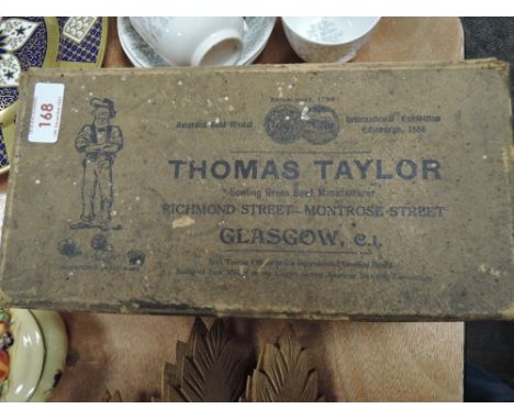 A boxed set of wooden Thomas Taylor Scotch bowls having been presented by Kirkby Lonsdale bowling club