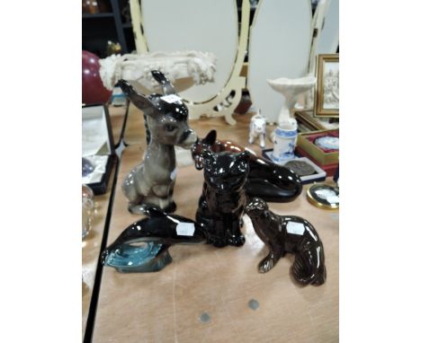 A collection of animal figurines including Poole dolphin and Sylvac cat.