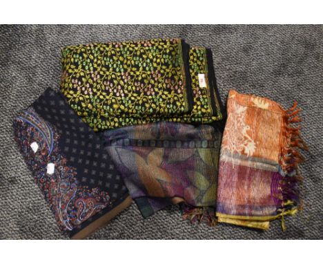A collection of vintage shawls, various fabrics and eras.