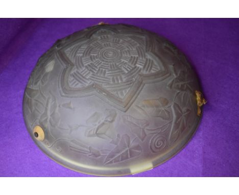 A pressed glass art deco ceiling light shade having ivy and geometric design