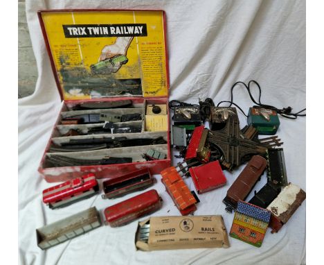 A box of vintage railway items to include a 00 gauge Trix twin railway set and 0 gauge tin plate items, Hafner &amp; similar 