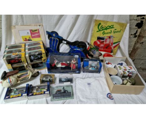 A collection of scooter related memorabilia to include boxed diecast items (Solido & Maisto), metal models, mugs and wall pla