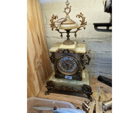A french onyx and brass mantle clock, height 49cm.  