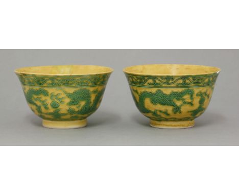 Two matching Bowls, Guangxu (1875-1908), the exterior incised and enamelled green with two dragons, pearls, clouds and flames