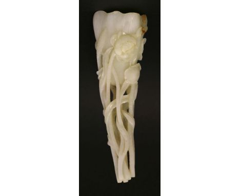 A white jade 'rhinoceros horn' Lotus Cup, early 20th century, with veins and growing from long stems with flowers, seedpods a