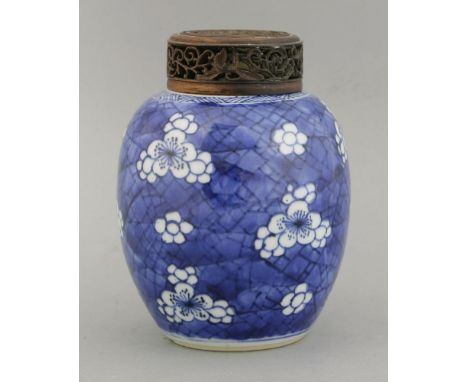 A blue and white Jar, Kangxi, c.1700, typically painted with prunus and cracked ice, the shoulders with basket weave, 14.5cm,