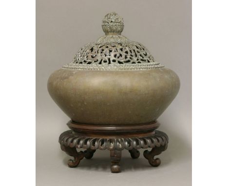 An unusual bronze Incense Burner and Cover, possibly 18th century, the onion body with double cloud border, the domed cover w