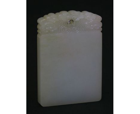 A white jade 'Ping An Wu Shi' Pendant, 19th century, well carved at the top with ruyi clouds above a blank tablet, 5.8cm  A b