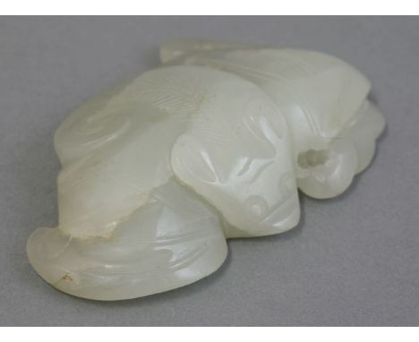 A jade pendant, 20th century, carved as a bat, 5.5cm