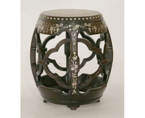 A hardwood drum-form Seat, c.1880, the top inset with rouge marble, above the pierced quatrefoil body, and inlaid with mother