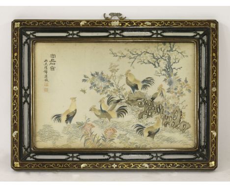 An appealing silk embroidered Panel, probably mid 19th century, with several cockerels in a garden, amongst rockwork, peony, 