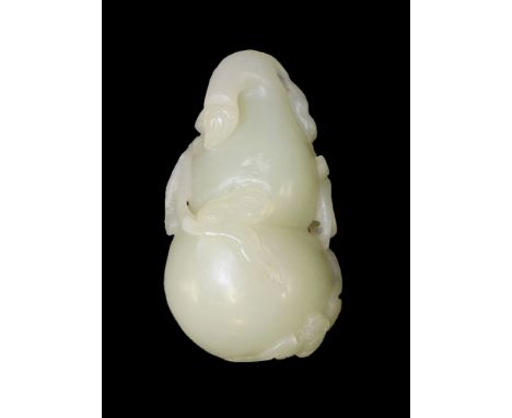 A good jade Pendant, 18th/19th century, the pale-green stone well carved as a double-gourd with stem, leaves, tendrils and th