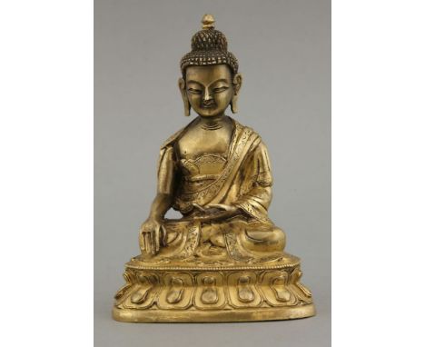 A Sino-Tibetan gilt bronze Buddha, probably 18th century, seated in engraved robes in bhumisparsha mudra on a waisted lotus b